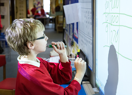 Student using whiteboard